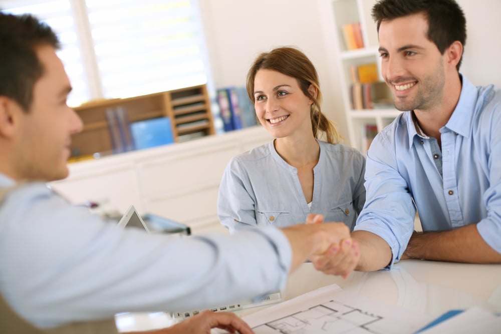 Young couple meeting construction planner Young couple meeting construction planner